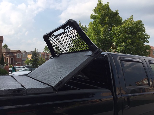 A Heavy Duty Tonneau Cover And Custom Headache Rack On A Ford Super