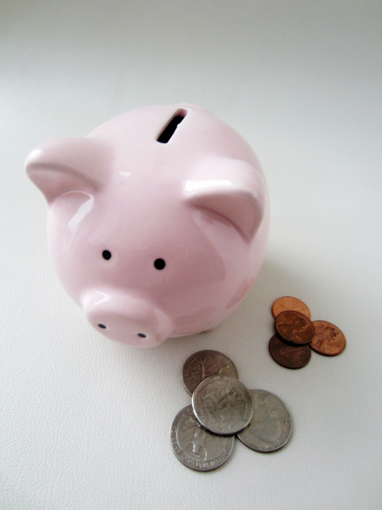 Money Box A money box next to a few American coins I am th… Flickr