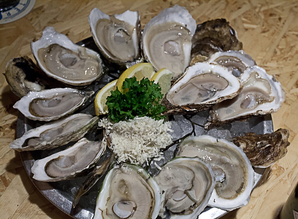 A dozen raw oysters Four different types for the three of … Pat