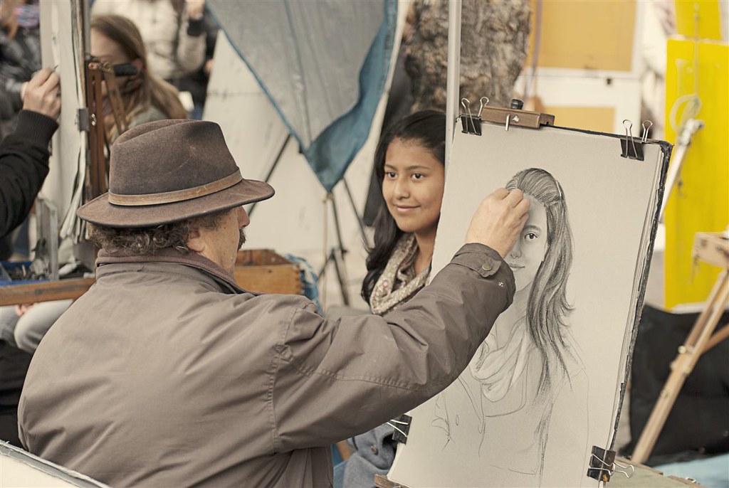 Portrait artist in action at Place du Tertre, Montmartre, … Flickr