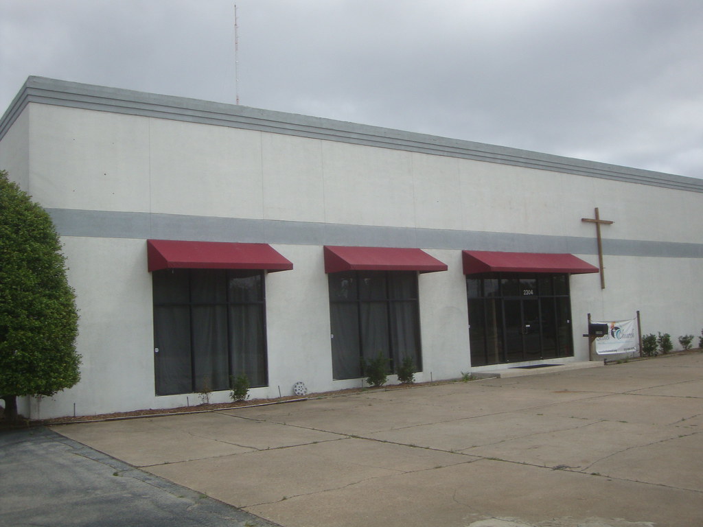 Car dealership church This building is also part of the fo… Flickr