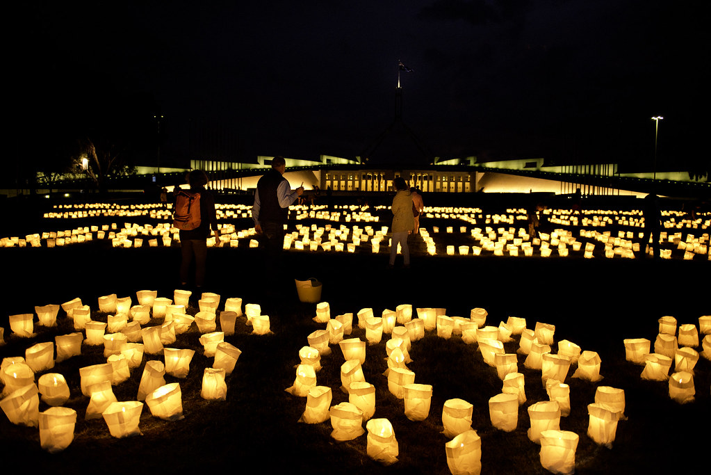 Earth hour 2014 Canberra group lighting candles 02 Flickr