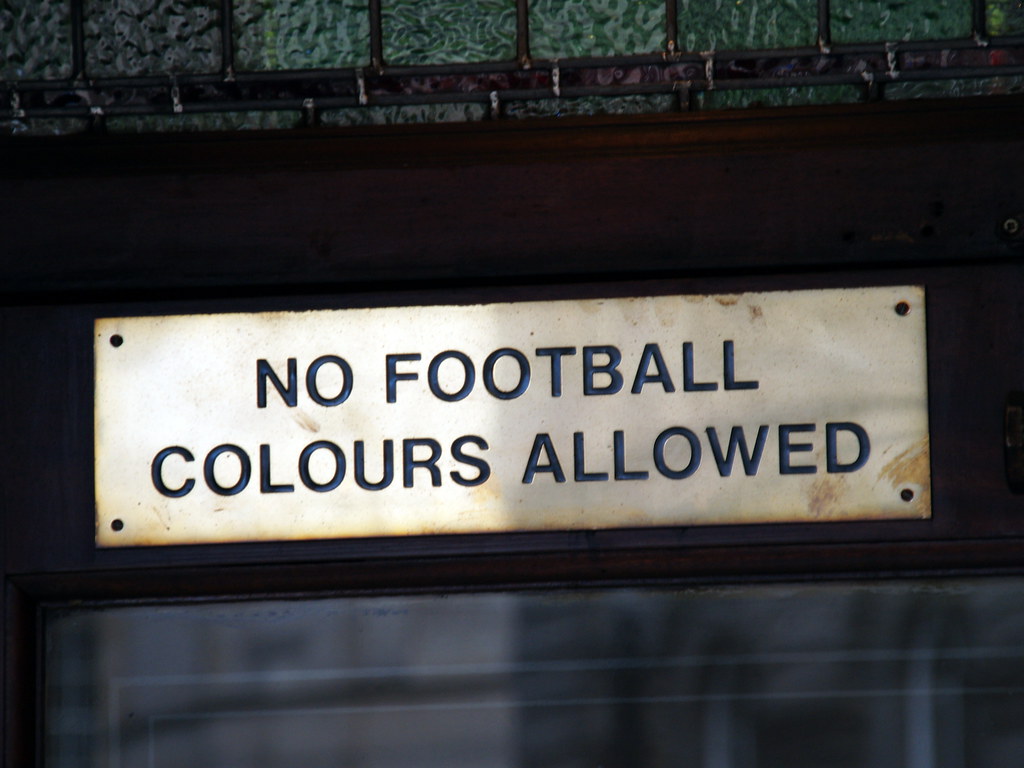 No football colours allowed Sign outside a pub in Edinburg… Flickr