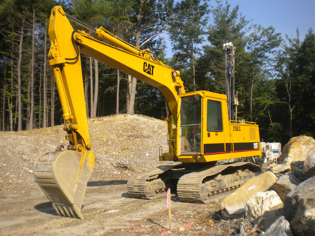 CAT 215DLC excavator at one of our crushing jobs Construction