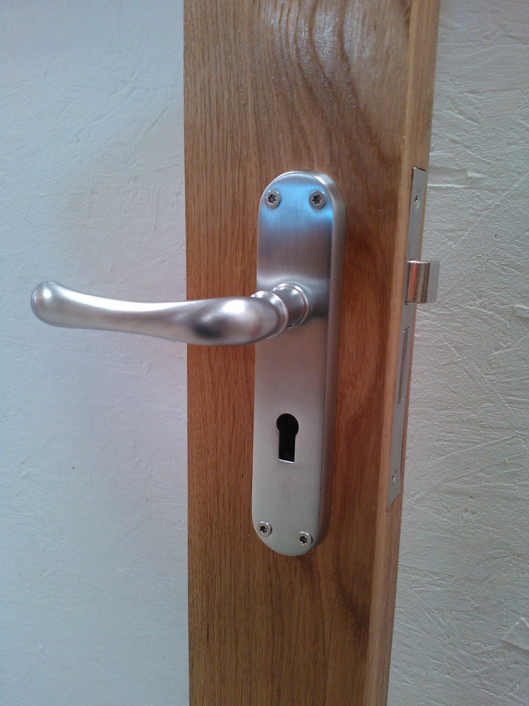 Stainless Handle On Oak Door Stainless steel door handle s… Flickr