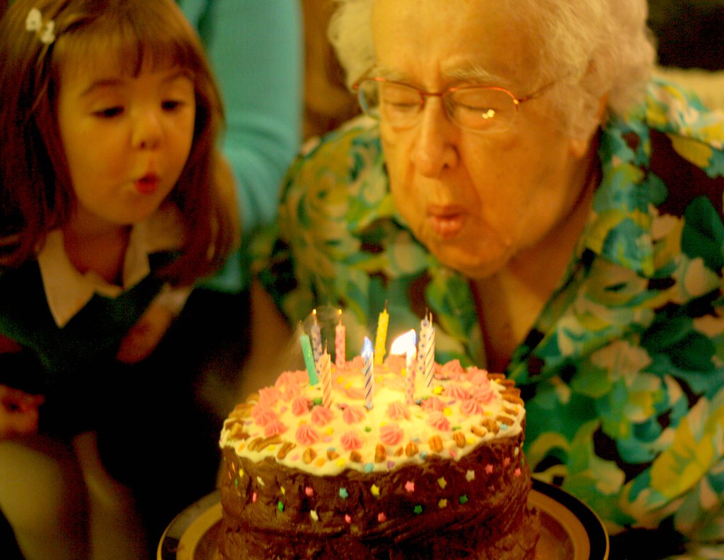 Presley helping her Great Grandmother blow out the candles… Flickr