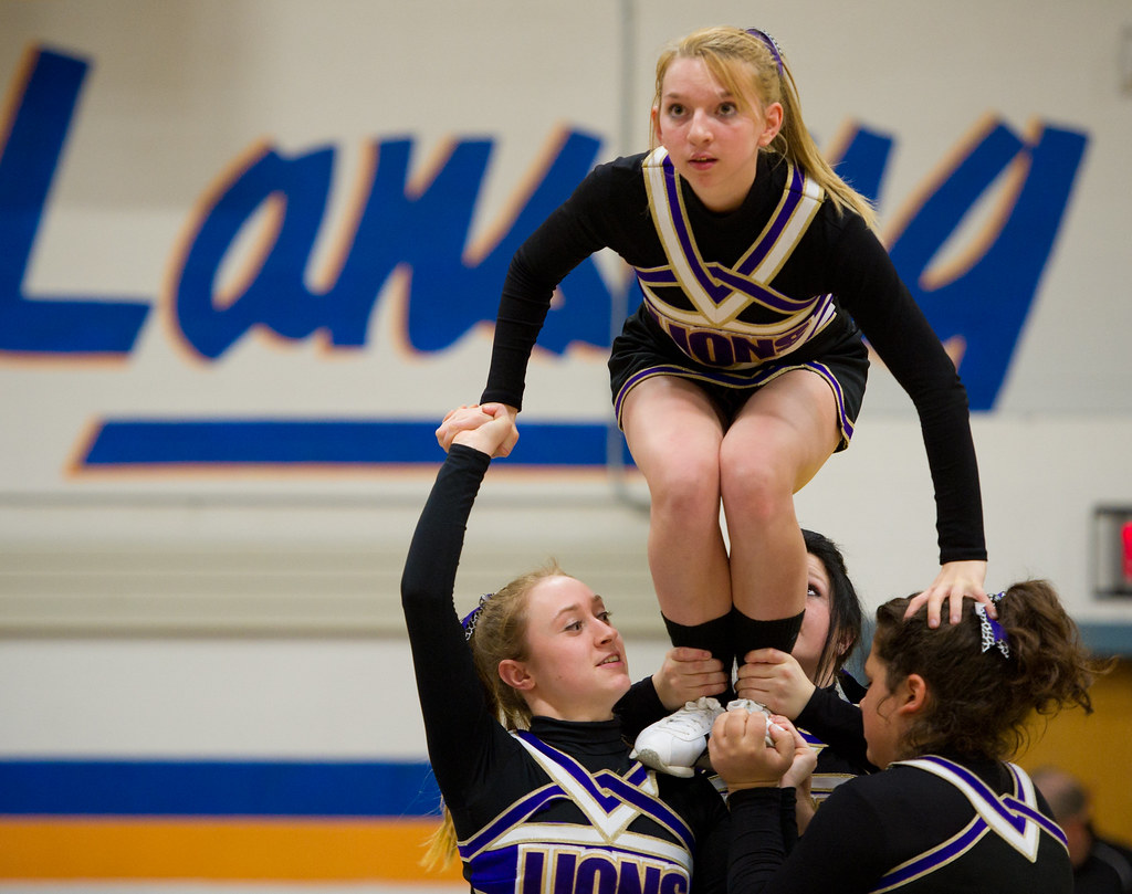 Dryden Cheerleaders steady a flyer before a high school v… Flickr