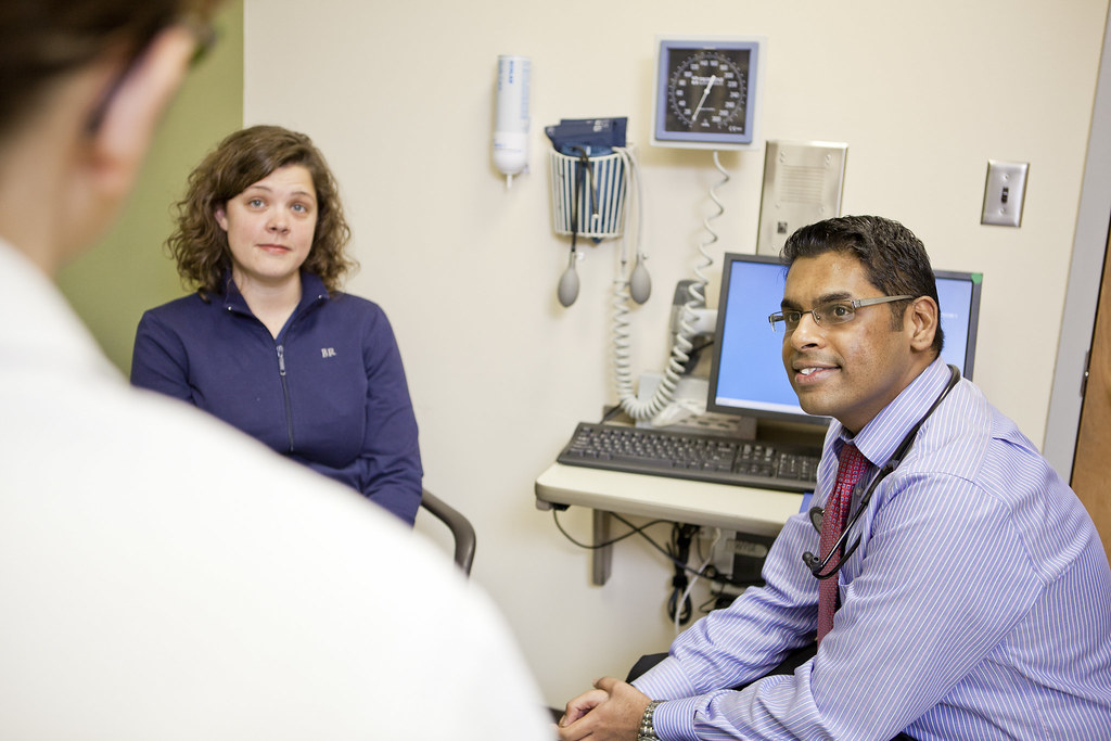 Doctors and residents working with patients at the JFK clinic in St. Louis. Satish