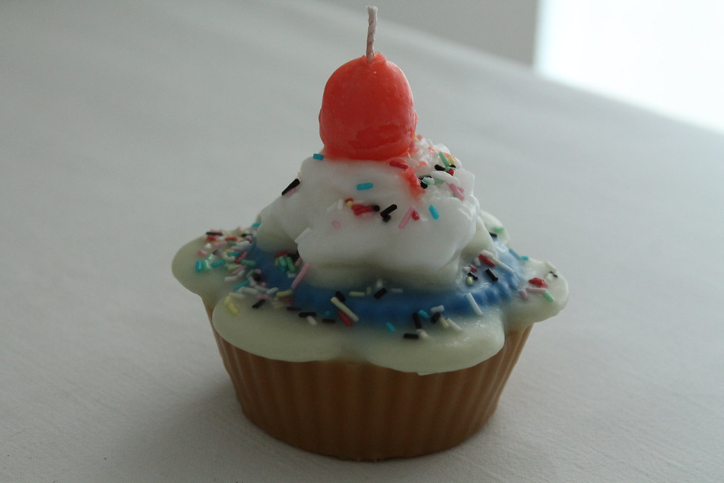 CUPCAKESHAPED CANDLE Round cupcakeshaped candle, covered… Flickr