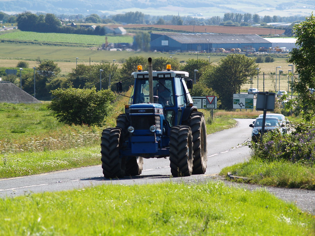Ford Tractor Big Blue Ford 8830 tractor powers up the hill… David