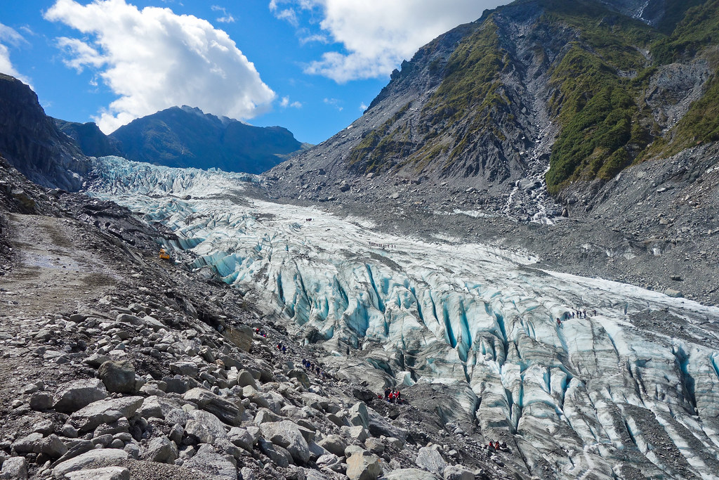 Hikers in Fox Glacier, New Zealand Groups of hikers along … Flickr