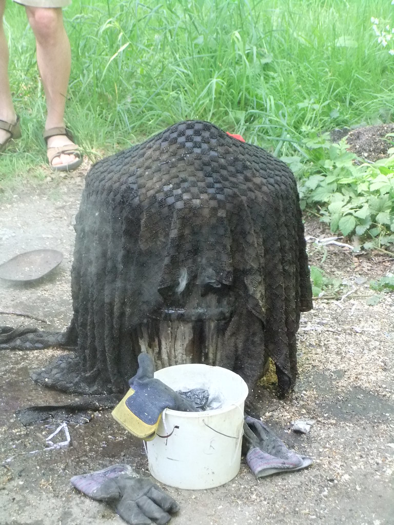 Cooling down A wet blanket on a bucket containing hot, fre… Flickr