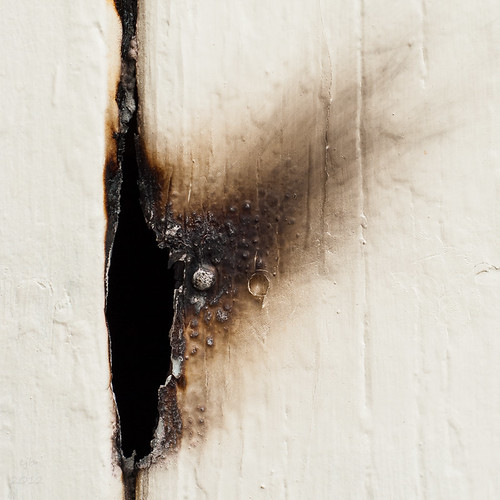 Burn mark (4 August 12) A hole in a wooden fence. Flickr