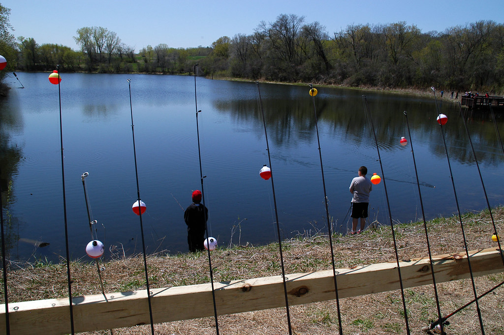 Fishing and Fishing Poles Several students fish at the far… Flickr