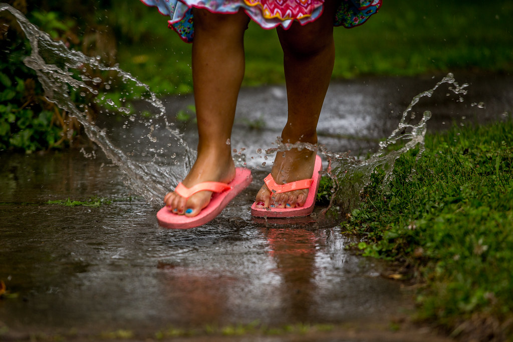 Puddles & Flip Flops Playing in a puddle after a rain stor… Flickr