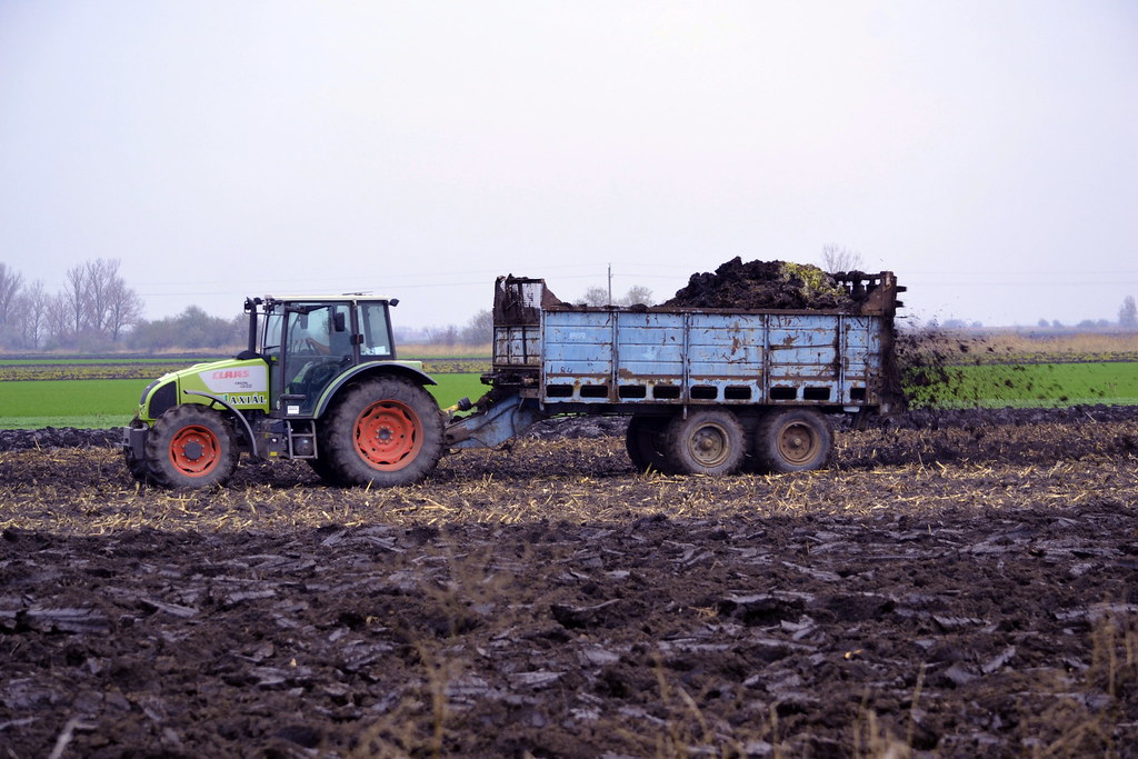 Muck spreading.. Watching the local farmers "dishing the d… Flickr