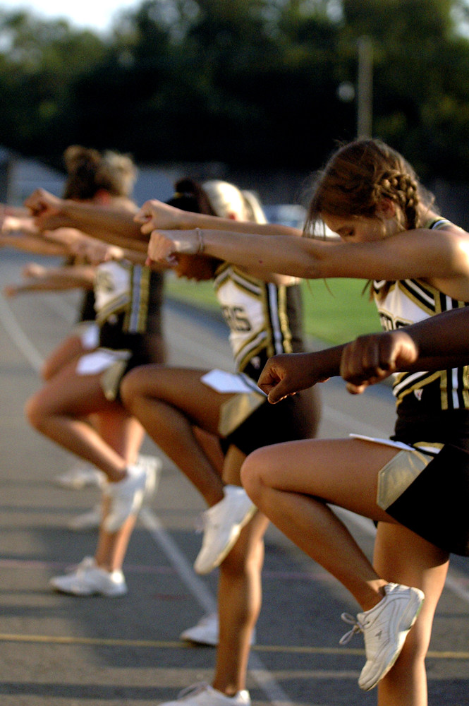 JV cheerleaders Jv cheerleaders cheering at a jv football