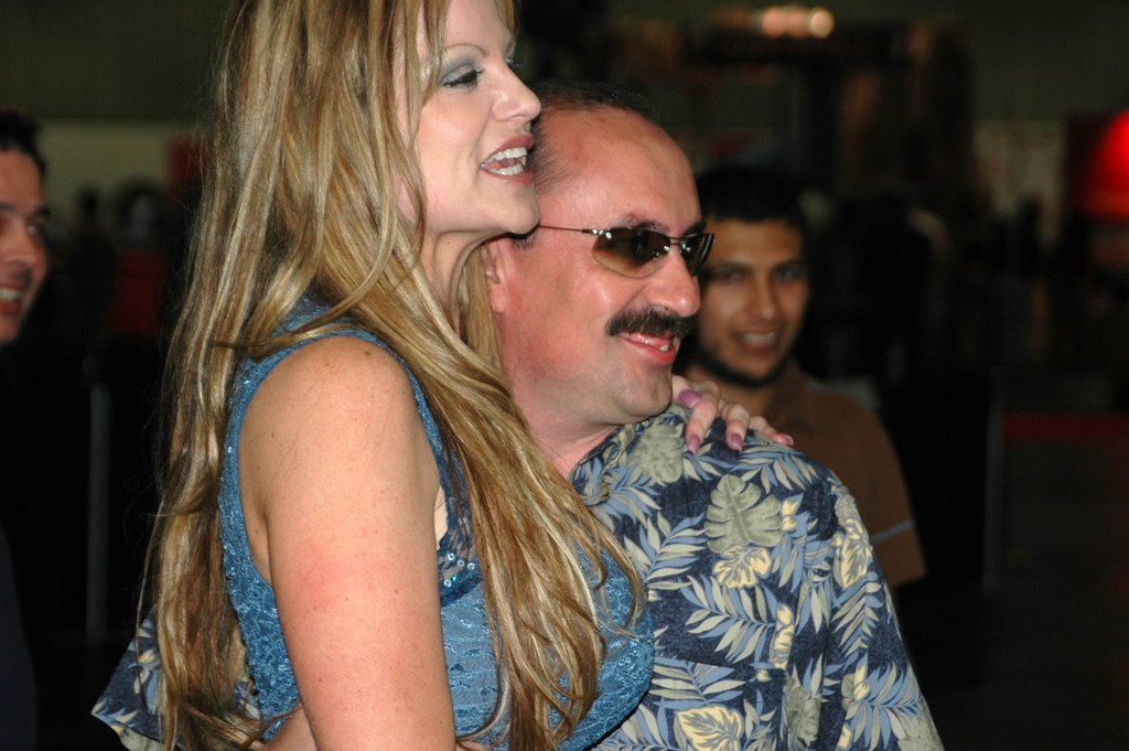 Kelly Madison posing with a fan - a photo on Flickriver