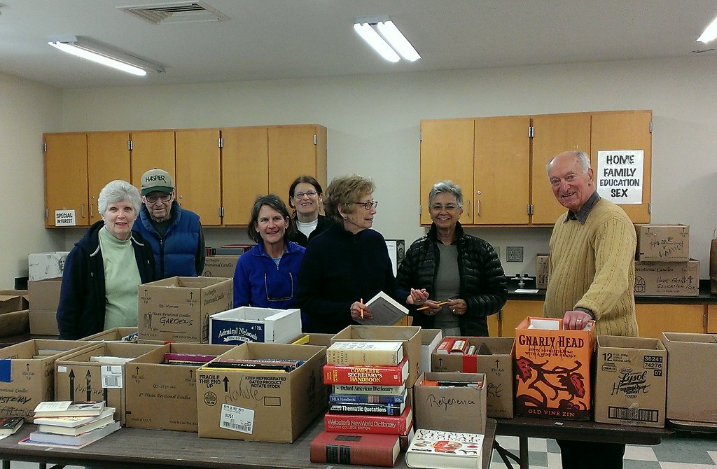Volunteers sorting for the summer book sale Lenox Library Flickr