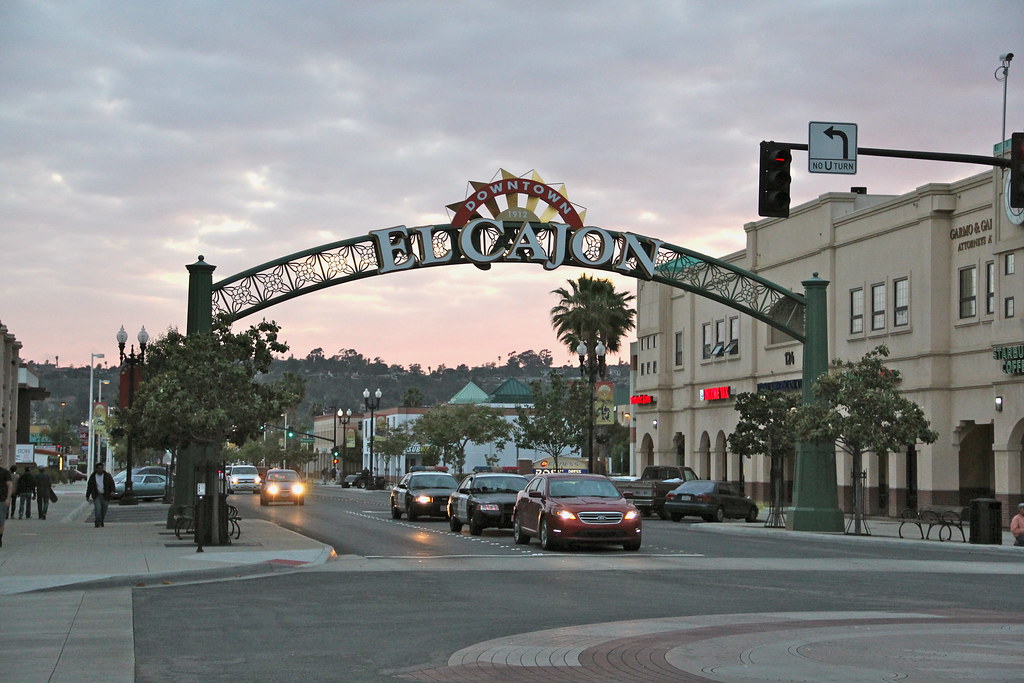 El Cajon car & 2 Police cars under Downtown sign Flickr