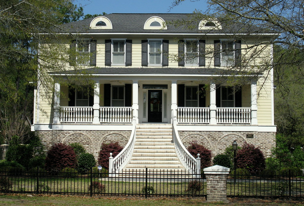 Paleyellow plantationstyle house with a grand balustrade… Flickr