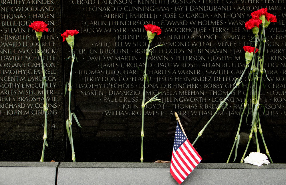 Vietnam Veterans Memorial Flowers and an American flag are… Flickr