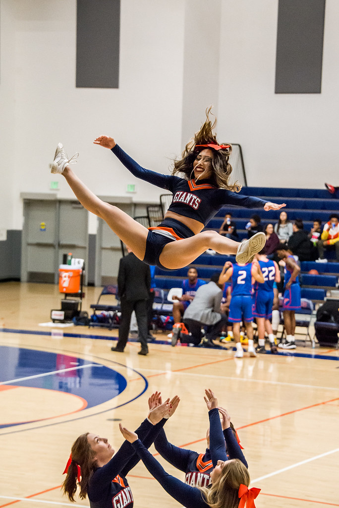 Cheerleader throw during COS basketball game timeout. Flickr