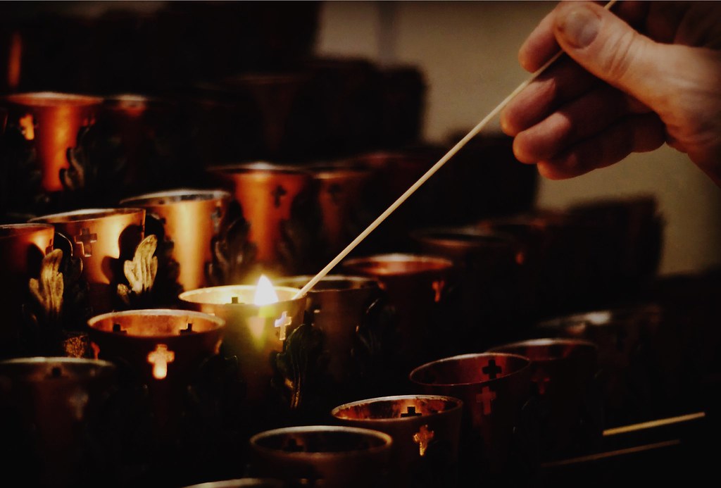 Lighting a candle for a loved one Teddy Bergstrom Flickr