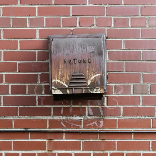 1958 rusty NuTone, slightly crooked, plus face graffiti