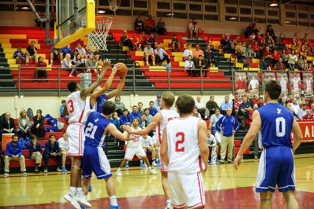 Basketball Wins Huge Upset over Jesuit on St. Aloysius Throwback Night