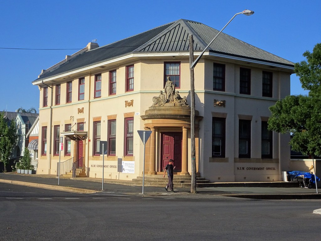 Young. The old AMP Society building with its statue logo b… Flickr