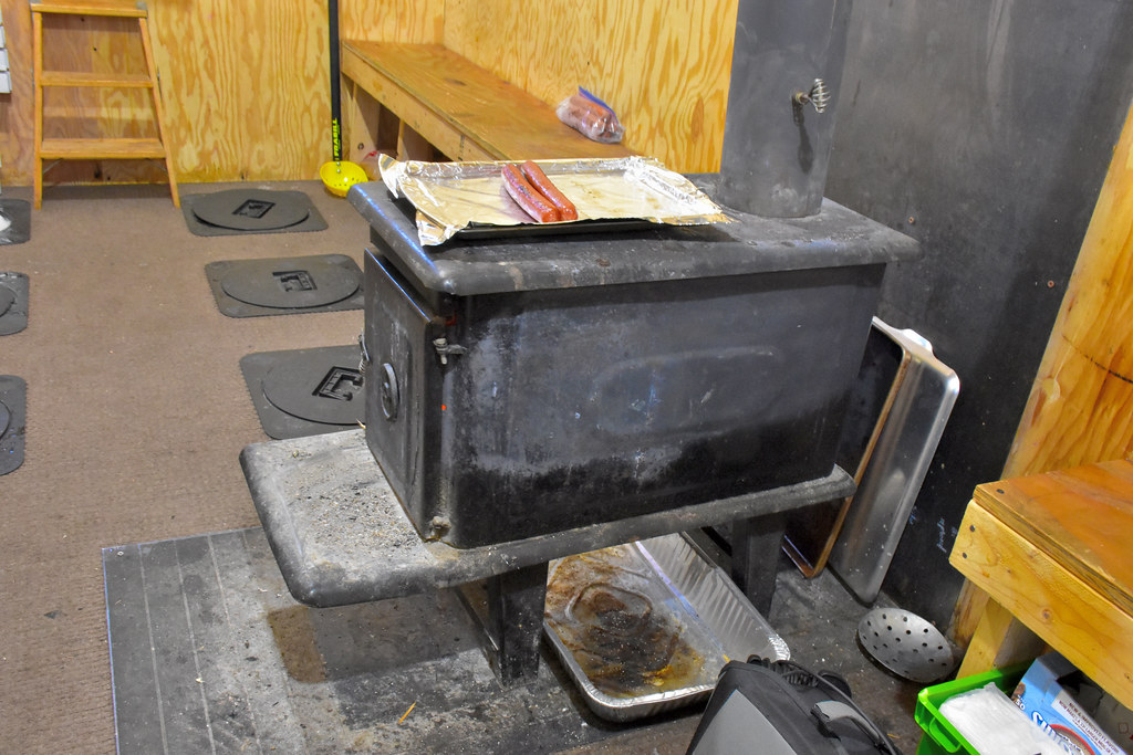 Grilling hot dogs on wood stove, Ice fishing Fairbanks, Al… Flickr