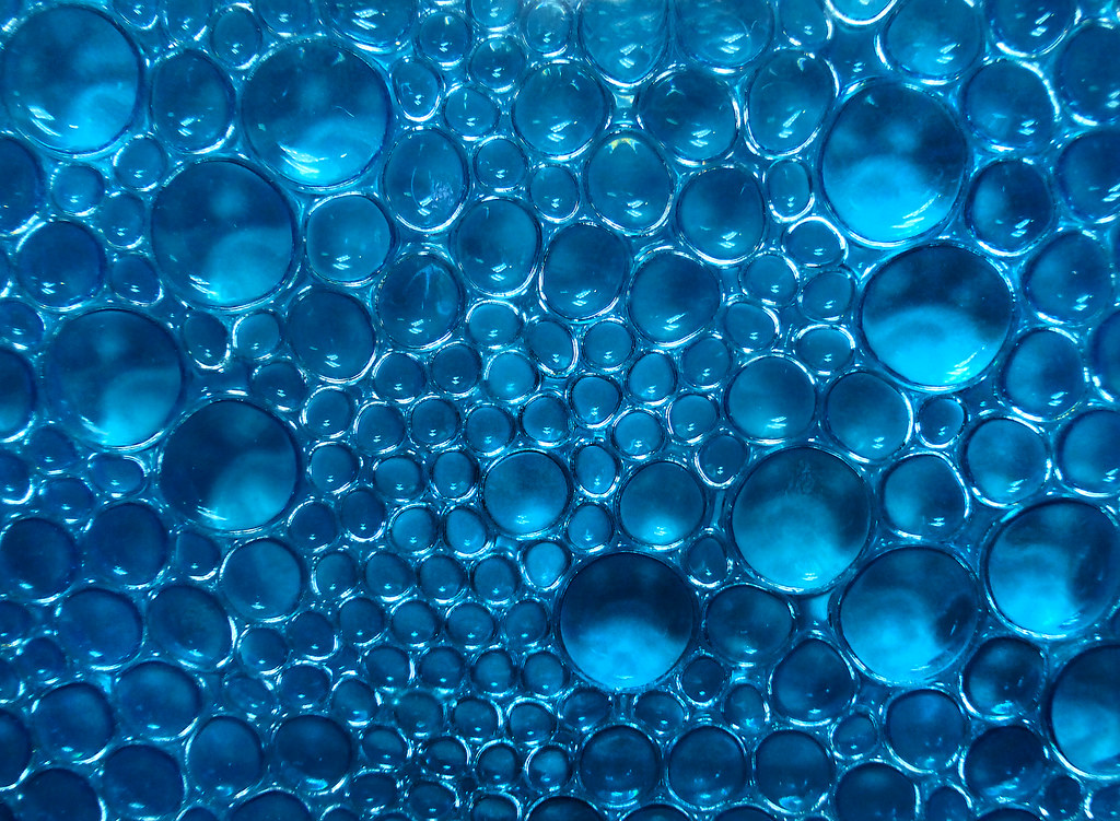 Bubbles in Blue Air bubbles trapped forever like a fly in … Flickr