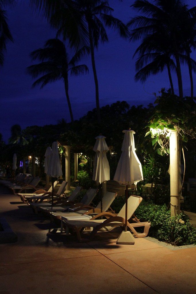 Deck chairs beside the pool at twilight a photo on Flickriver