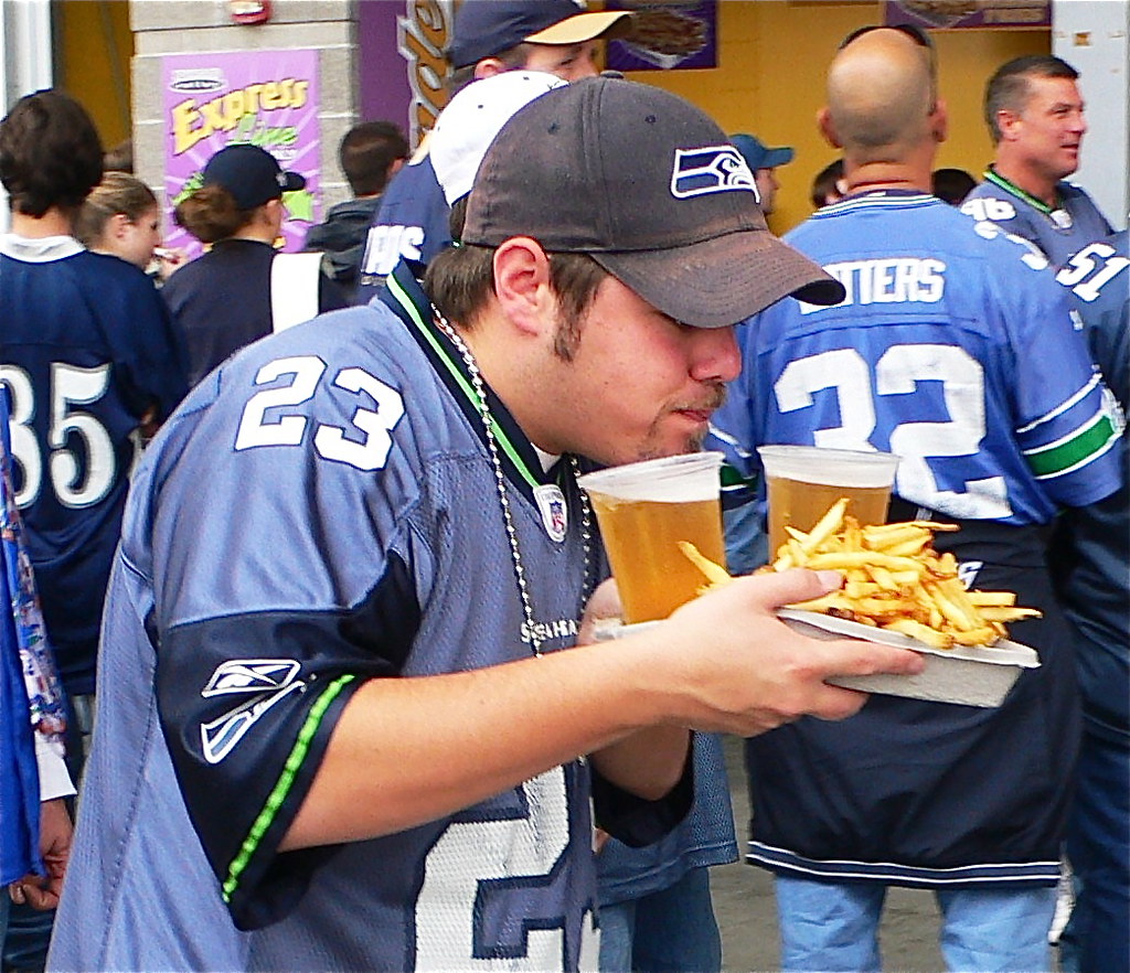 Seahawks fan, with beer and garlic fries. Seattle sbally. Flickr