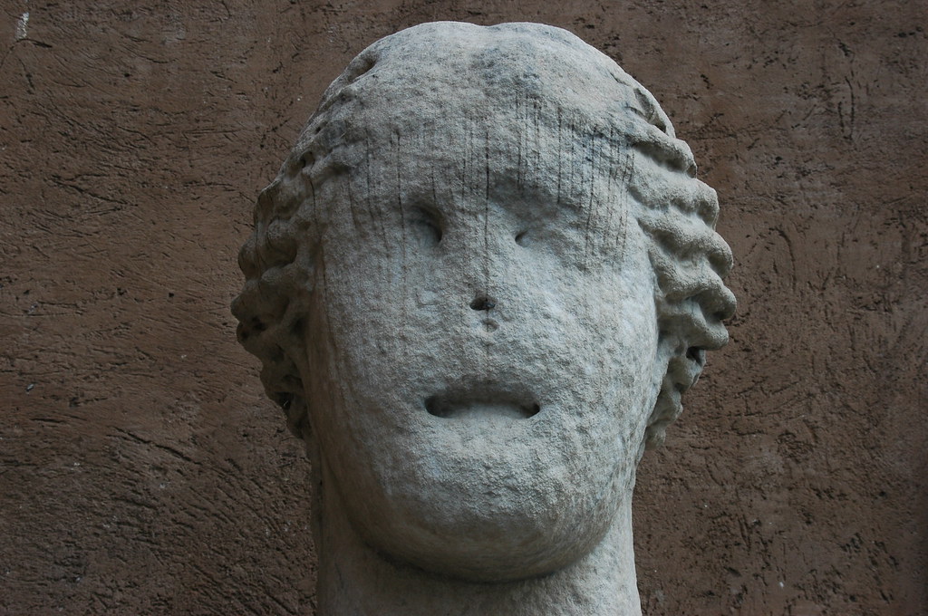 weathered face acid raineroded face of a statue from roma… Flickr