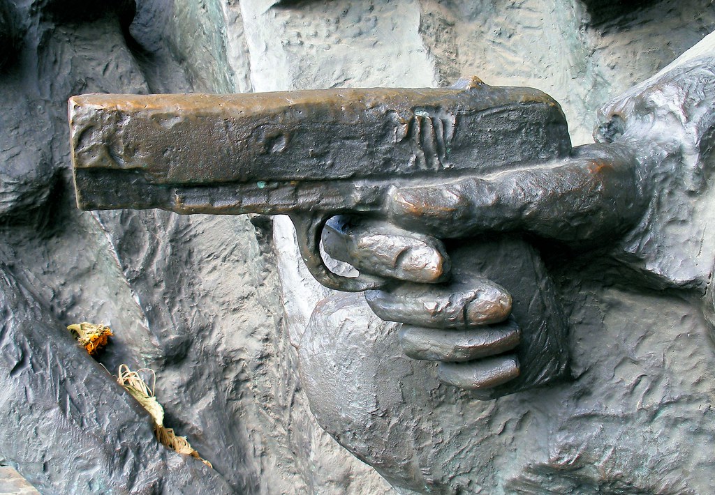 Gun Part of a statue in Warsaw, Poland. scrappy annie Flickr