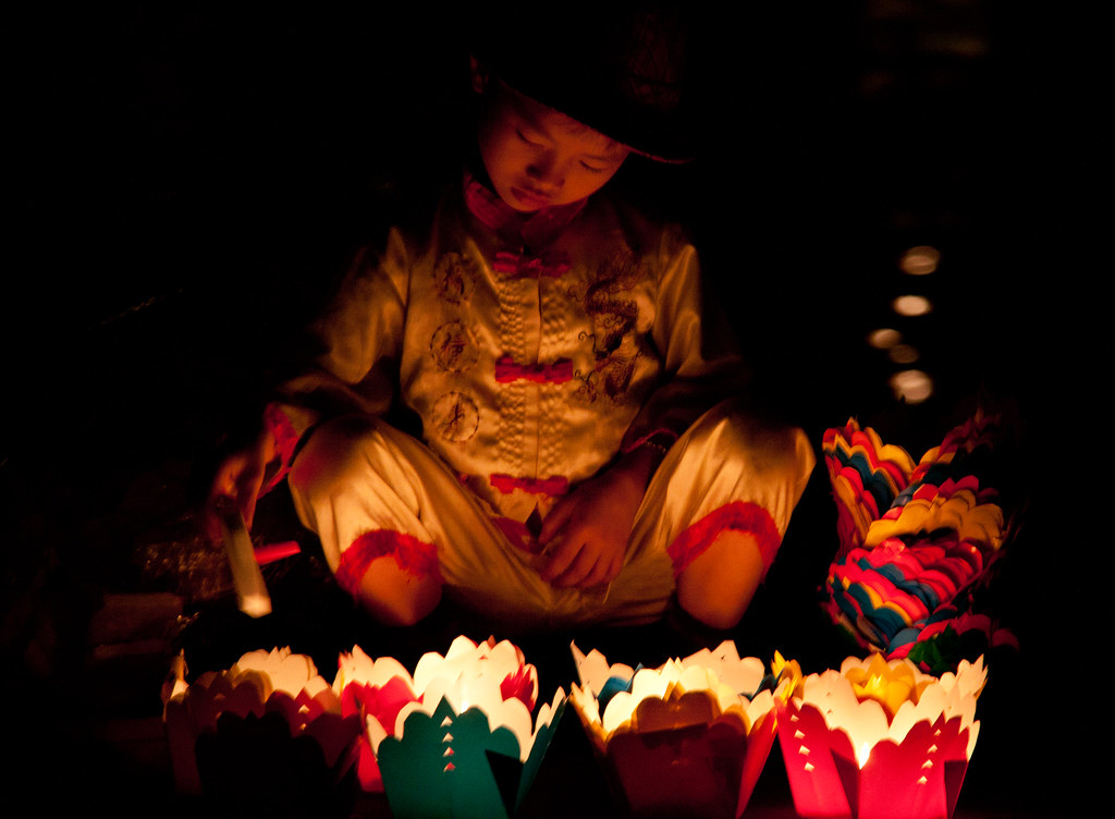 Boy Selling Floating Candles in Hoi An, Vietnam ChrisGoldNY Flickr