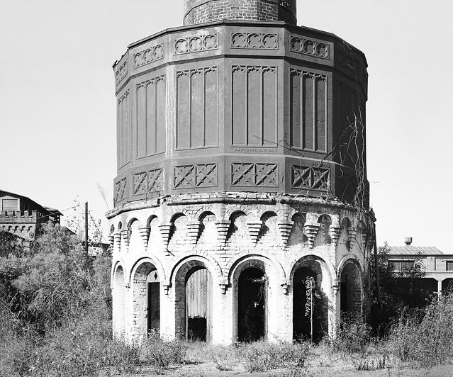 Central Of former roundhouse and smoke stack is seen