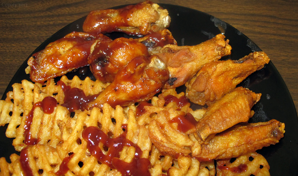 Wings and waffle fries Four Buffalo and four BBQ wings wit… Flickr