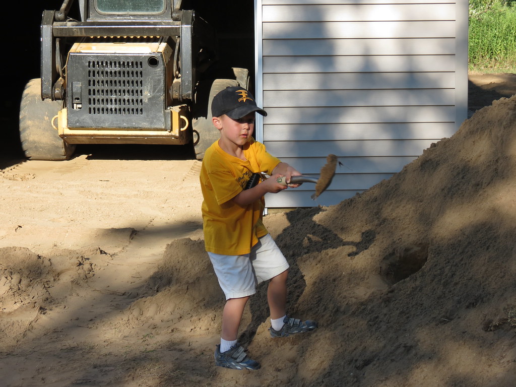 Shoveling the dirt pile Matthew loves his new shovel he go… Flickr