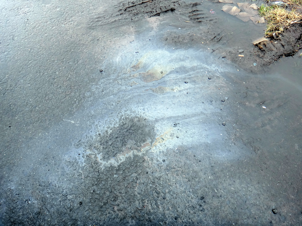 DSC00761 Oil drip under car, but fortunately not my oil Flickr