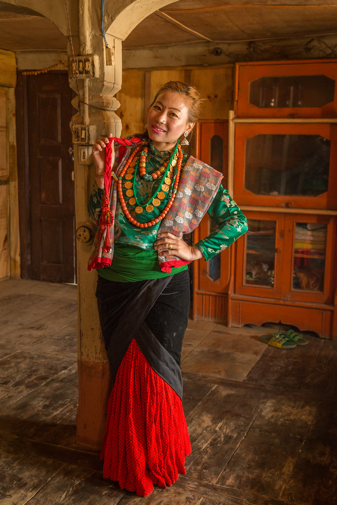 Traditional Thakali Dress A Thakali woman of Nepal shows o… Flickr