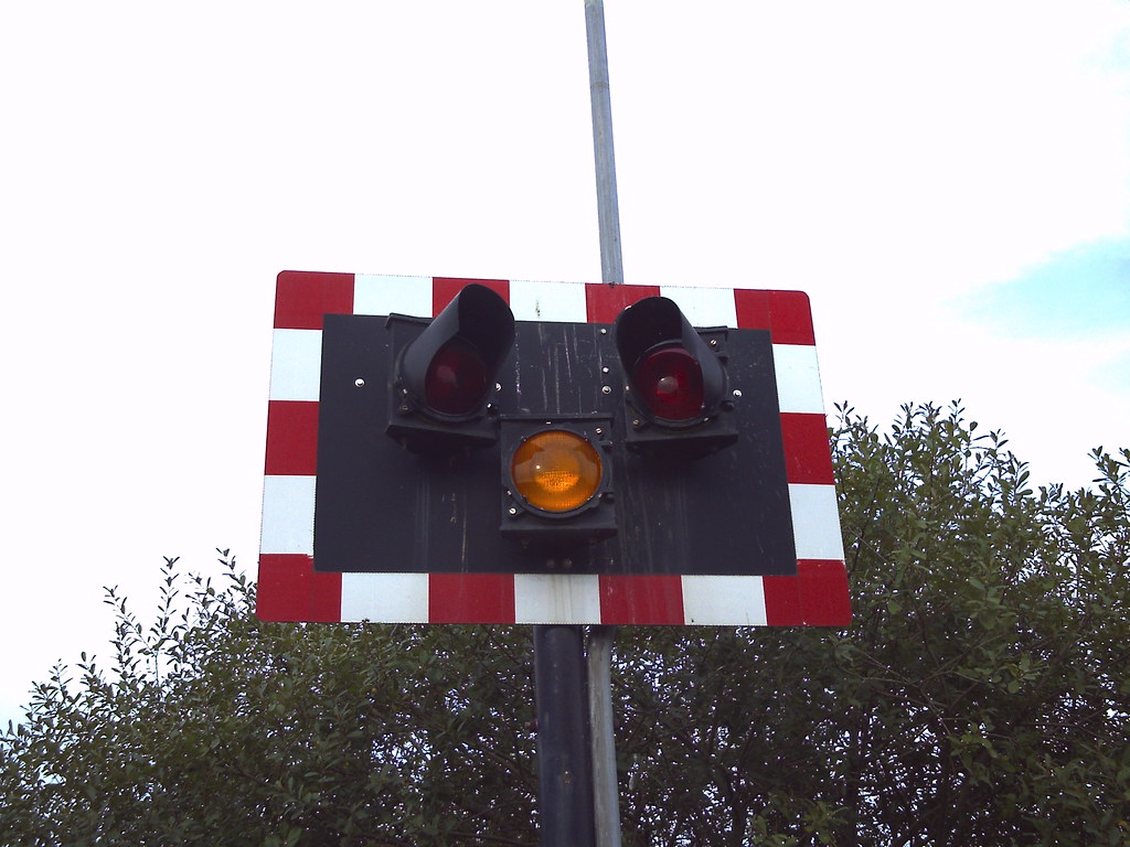 Level crossing warning lights. They may never alert the pu… Flickr