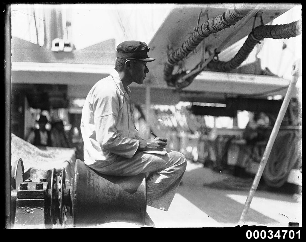Japanese sailor sitting on a winch probably on board naval vessel TAISEI MARU, 19061934 a