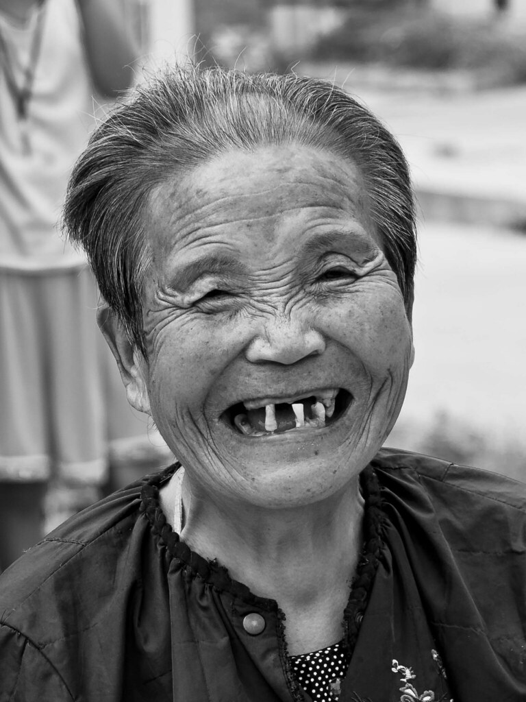 An Almost Toothless Smile (No FB account) Old woman in a