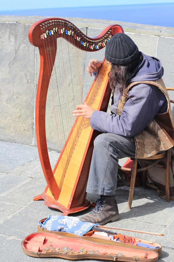 A man playing a celtic harp Sami Pyylampi Flickr