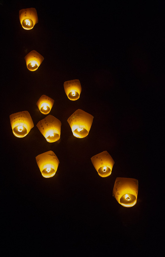 Sky lanterns Carrying wishes to the sky. Arist Xiong Flickr