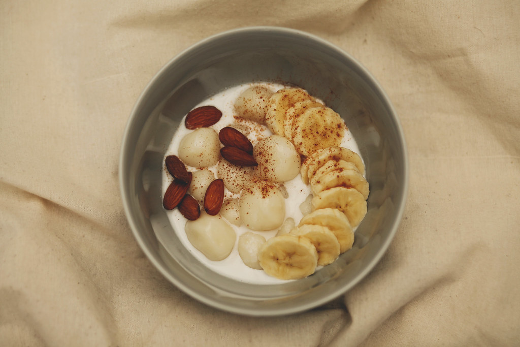 Sticky rice flour balls with coconut milk, banana, almonds… Flickr