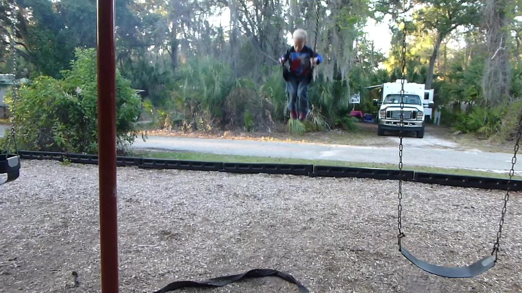Camping Trip Paxton enjoying the swings at the park's play… Flickr